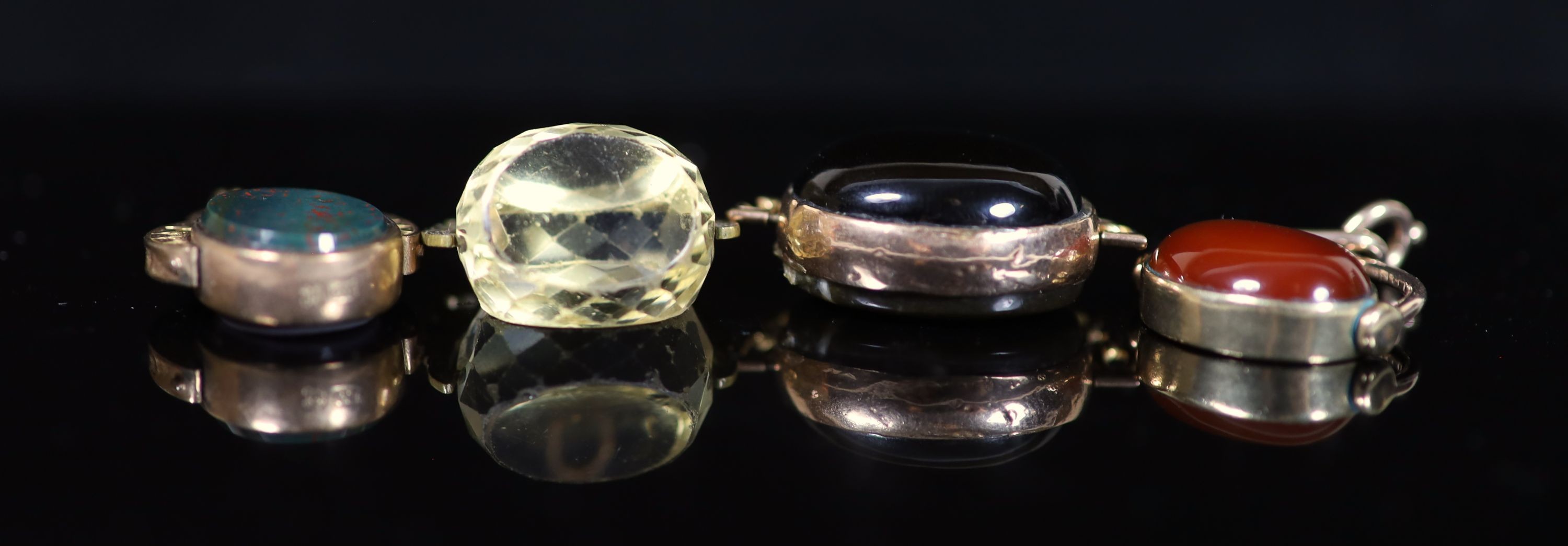Four assorted gold and chalcedony set swivelling fob seals, three hallmarked for late 19th and early 20th century